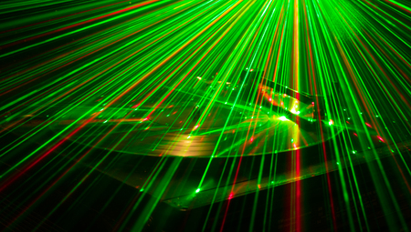 Turntable vinyl record player. Retro audio equipment for disc jockey. Sound technology for DJ to mix & play music. Vinyl record being played against burning fire background with smokeの写真素材