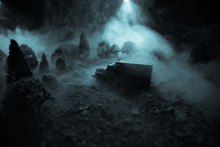 War Concept. Military silhouettes fighting scene on war fog sky background, World War Soldiers Silhouettes Below Cloudy Skyline At night. Attack scene. Armored vehicles. Selective focus. Decorationの写真素材