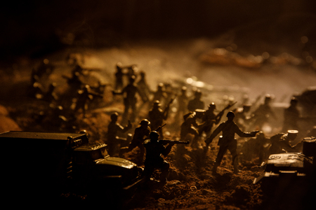 War Concept. Military silhouettes fighting scene on war fog sky background, World War Soldiers...