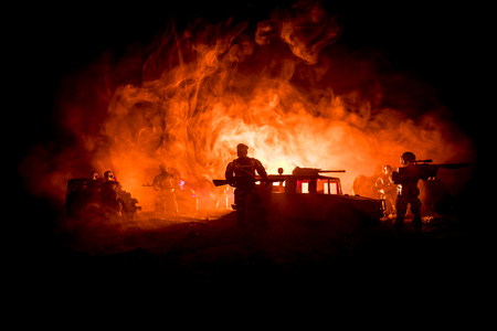 War Concept. Military silhouettes fighting scene on war fog sky background, Fighting silhouettes Below Cloudy Skyline At night. Battle scene. Army jeep vehicle with soldiers. army jeepの写真素材