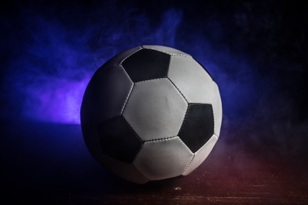 Close up view of soccer ball on dark background. Football game conceptual shot. Selective focusの写真素材