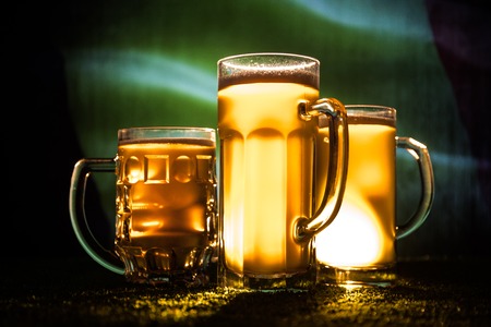 Soccer 2018. Creative concept. Beer glasses on table. Support your country with beer concept. Selective focusの写真素材