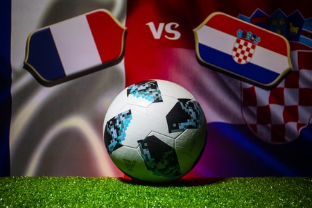 BAKU,AZERBAIJAN - JULY 12, 2018 : Creative concept. Official Russia 2018 World Cup football ball The Adidas Telstar 18 on green grass. France and Croatia. Selective focusのeditorial素材