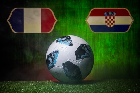 BAKU,AZERBAIJAN - JULY 12, 2018 : Creative concept. Official Russia 2018 World Cup football ball The Adidas Telstar 18 on green grass. France and Croatia. Selective focusのeditorial素材
