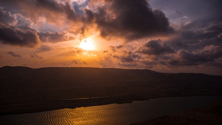Beautiful sunset at Lake Xojasan, Baku Azerbaijan, landscape of mountains clouds and lake
