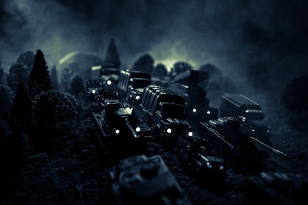 War Concept. Military silhouettes fighting scene on war fog sky background, World War Soldiers...