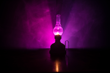 Oil Lamp Lighting up the Darkness or Burning kerosene lamp background, concept lightingの写真素材