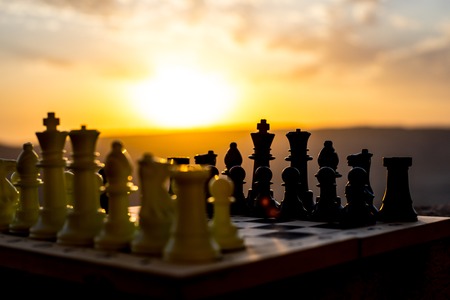 chess board game concept of business ideas and competition and strategy ideas. Chess figures on a...