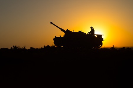 War Concept. Military silhouettes fighting scene. World War German Tanks and soldiers silhouettes at...