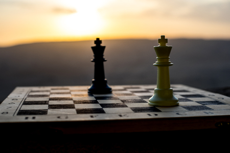 chess board game concept of business ideas and competition and strategy ideas. Chess figures on a chessboard outdoor sunset background. Selective focusの写真素材