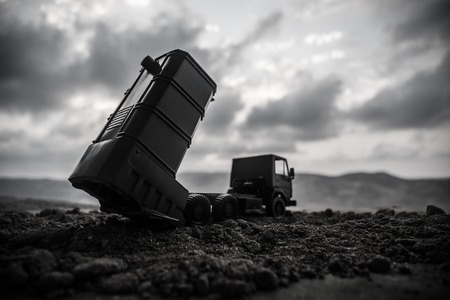 War concept. Battle scene with rocket launcher aimed at gloomy sky at sunset time. Rocket vehicle ready to attack on cloudy war Background. Selective focusの写真素材