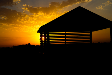 View from alcove on orange sunset sky. Seaside tropics. Selective focus. Beach side conceptの写真素材
