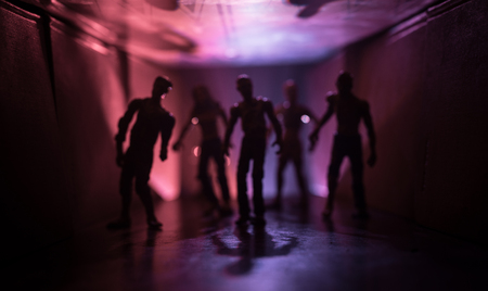 Creepy silhouette in the dark abandoned building. The zombie apocalypse concept or Dark corridor...