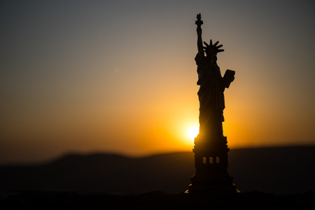 Statue of Liberty on the background of colorful dawn sky. Table decorationの写真素材