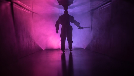 Creepy silhouette in the dark abandoned building.