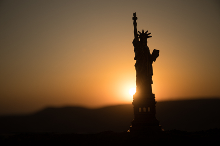 Statue of Liberty on the background of colorful dawn sky. Table decorationの写真素材