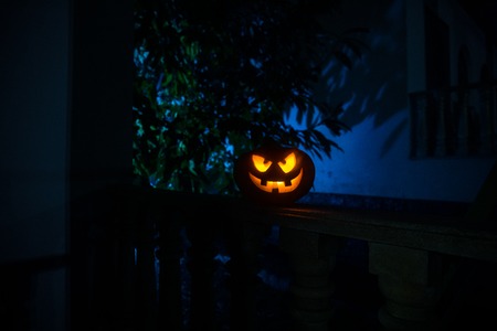 Halloween pumpkin. Carved Halloween pumpkin glowing in the dark. Outdoor shot
