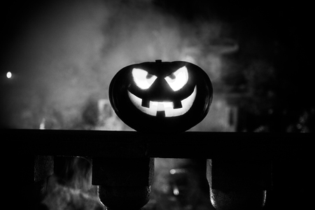 Halloween pumpkin. Carved Halloween pumpkin glowing in the dark. Outdoor shotの写真素材