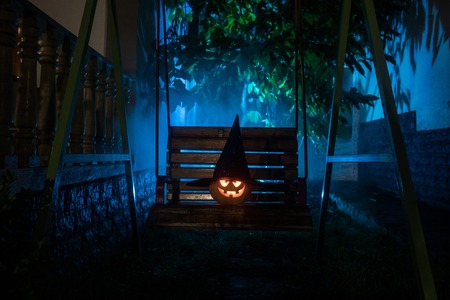 Halloween pumpkin. Carved Halloween pumpkin glowing in the dark. Outdoor shotの写真素材