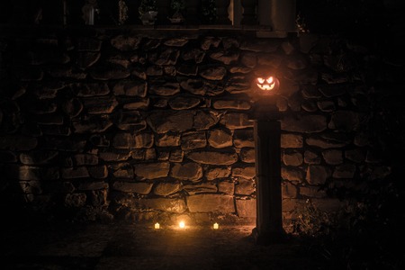 Halloween pumpkin. Carved Halloween pumpkin glowing in the dark. Outdoor shotの写真素材