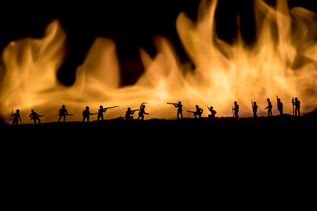American Civil War Concept. Military silhouettes fighting scene on war fog sky background. Attack scene. Selective focusの写真素材