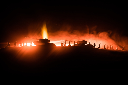 War Concept. Military silhouettes fighting scene on war fog sky background, World War German Tanks Silhouettes Below Cloudy Skyline At night. Attack scene. Armored vehicles. Tanks battleの写真素材