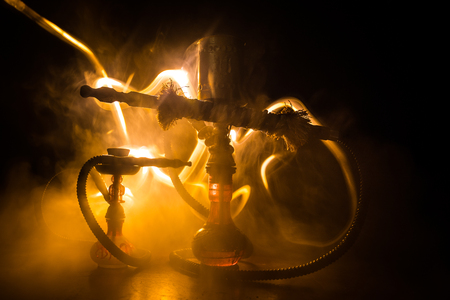 Hookah hot coals on shisha bowl making clouds of steam. Shisha explosion. Stylish oriental shisha in...