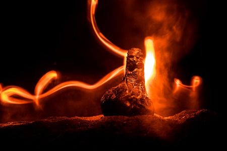 Horror silhouette of scary figure at night. Female demon. Demons coming. Slhouette of devil or monster figure on a background of fire. Horror viewの写真素材