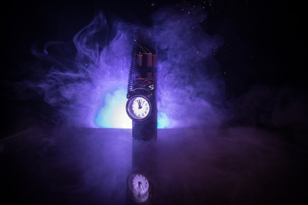 Image of a time bomb against dark background. Timer counting down to detonation illuminated in a...