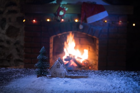 Christmas Room Interior Design, Closeup view of Christmas decorations on table with snow and fireplace on background. Empty space for your text. Selective focusの写真素材