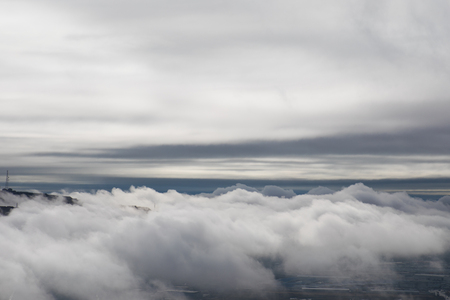 Beautiful clouds covered mountains. Morning fog in the mountain in Baku. Azerbaijan. Near Xojasan Lake.の写真素材