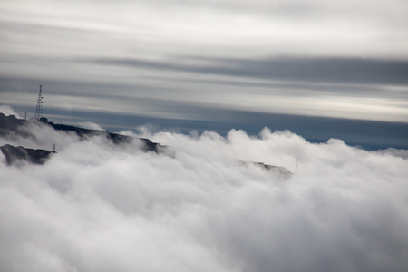 Beautiful clouds covered mountains. Morning fog in the mountain in Baku. Azerbaijan. Near Xojasan Lake.の写真素材