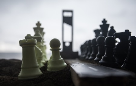 Chess concept of business and strategy ideas. Empty road with giant chess figures and Guillotine....