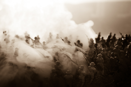 Battle scene. Military silhouettes fighting scene on war fog sky background. World War Soldiers Silhouettes Below Cloudy Skyline At sunset. Artwork Decoration. Selective focusの写真素材