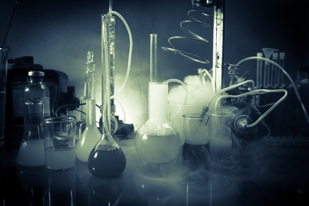 Pharmacy and chemistry theme. Test glass flask with solution in research laboratory. Science and...