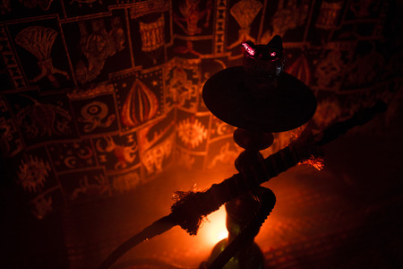 Hookah hot coals on shisha bowl on dark foggy background. Stylish oriental shisha. Creative conceptの写真素材