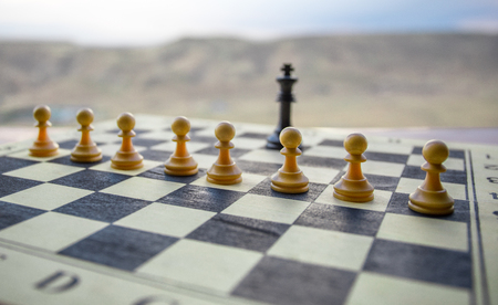Chess board game concept of business ideas and competition. Chess figures on a chessboard. Outdoor...