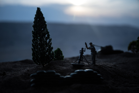 War Concept. Military silhouettes fighting scene on war fog sky background, World War Soldiers Silhouette Below Cloudy Skyline at sunset.の写真素材