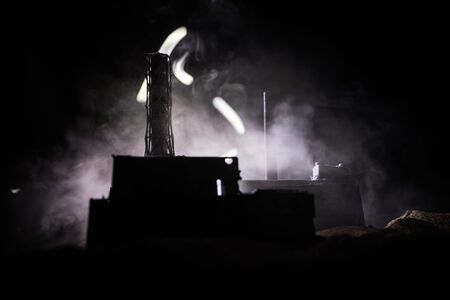 Creative artwork decoration. Chernobyl nuclear power plant at night. Layout of abandoned Chernobyl station after nuclear reactor explosion. Selective focusの写真素材