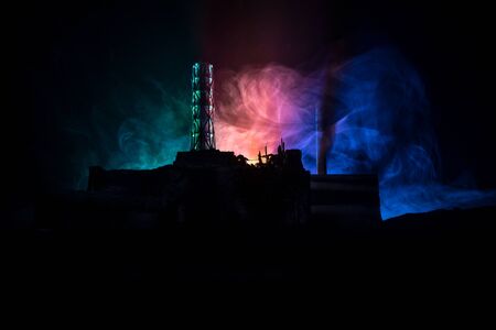 Creative artwork decoration. Chernobyl nuclear power plant at night. Layout of abandoned Chernobyl station after nuclear reactor explosion. Selective focusの写真素材