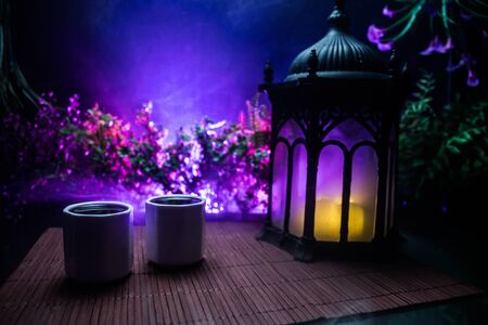 Tea concept. Japanese tea ceremony culture east beverage. Teapot and cups on table with bamboo and tradicional Japan ornament decor elementsの写真素材