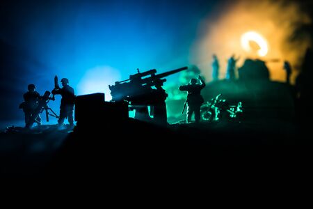 War Concept. Military silhouettes fighting scene on war fog sky background, World War Soldiers Silhouette Below Cloudy Skyline At night.の写真素材
