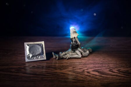 Give condom safe sex concept. Prevent infection and Contraceptives control the birth rate or safe prophylactic. Condom ready to use on table. Creative artwork ideas. Leave space for textの写真素材