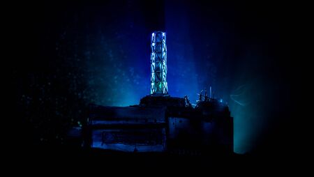 Creative artwork decoration. Chernobyl nuclear power plant at night. Layout of abandoned Chernobyl station after nuclear reactor explosion. Selective focusの写真素材