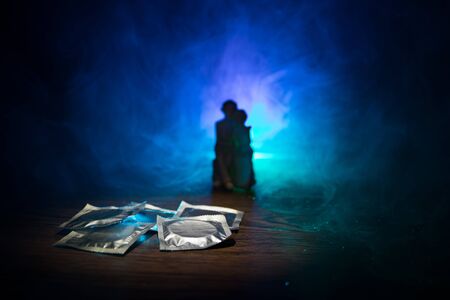 Give condom safe sex concept. Prevent infection and Contraceptives control the birth rate or safe prophylactic. Condom ready to use on table. Creative artwork ideas. Leave space for textの写真素材