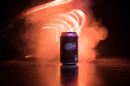 BAKU, AZERBAIJAN - SEPTEMBER 15, 2019: Can of Dr Pepper soft drink on dark toned foggy background...