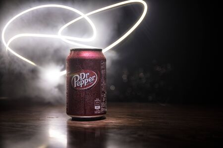 BAKU, AZERBAIJAN - SEPTEMBER 15, 2019: Can of Dr Pepper soft drink on dark toned foggy background...
