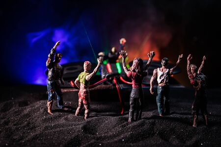 Happy Halloween horror party concept. Scary view of dancing zombies at cemetery with Dj and club lights. Creative artwork decoration. Useful as a party poster or greeting card. Selective focusの写真素材