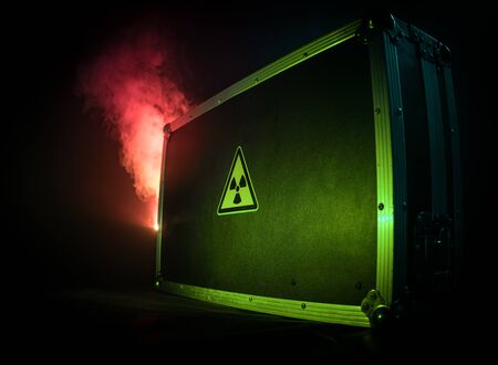 Radioactive (atomic ionizing radiation) danger warning symbol in triangular on a black case. Black...