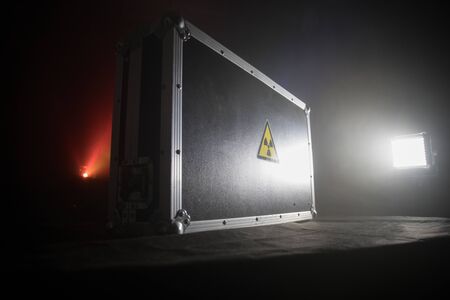 Radioactive (atomic ionizing radiation) danger warning symbol in triangular on a black case. Black...